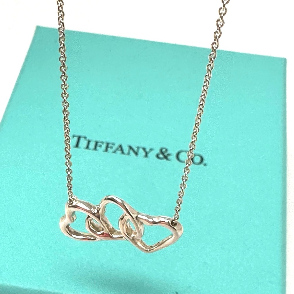 Authentic Tiffany & CO.  Triple open Hearts Pendant Necklace.